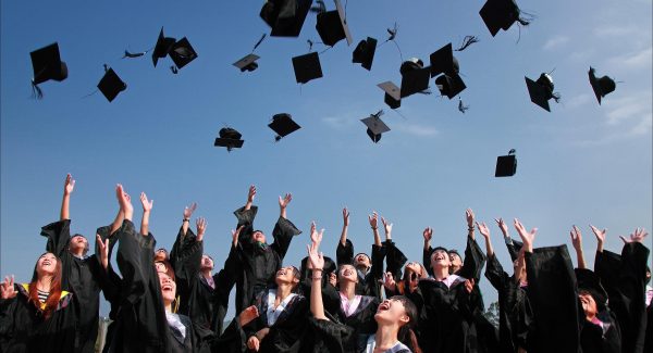 Graduates throwing caps